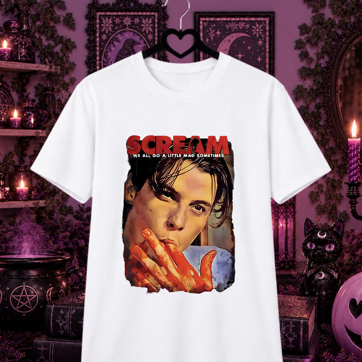 Billy Loomis shirt : A white short-sleeve graphic T-shirt hanging on a black hanger against a dark, purple-lit Halloween-themed background. The shirt features a large front print with the word 'SCREAM' in red and white, plus a stylized portrait of a Billy Loomis with red hands.