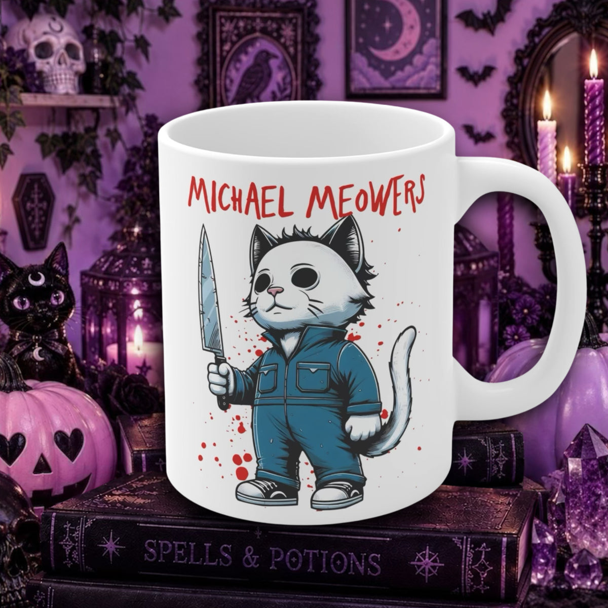A white ceramic mug featuring a cartoon cat dressed in blue overalls holding a knife, with the text 'MICHAEL MEOWERS' above it. The mug is displayed in a Halloween-themed setting with purple candles, a black cat figurine, and gothic books.