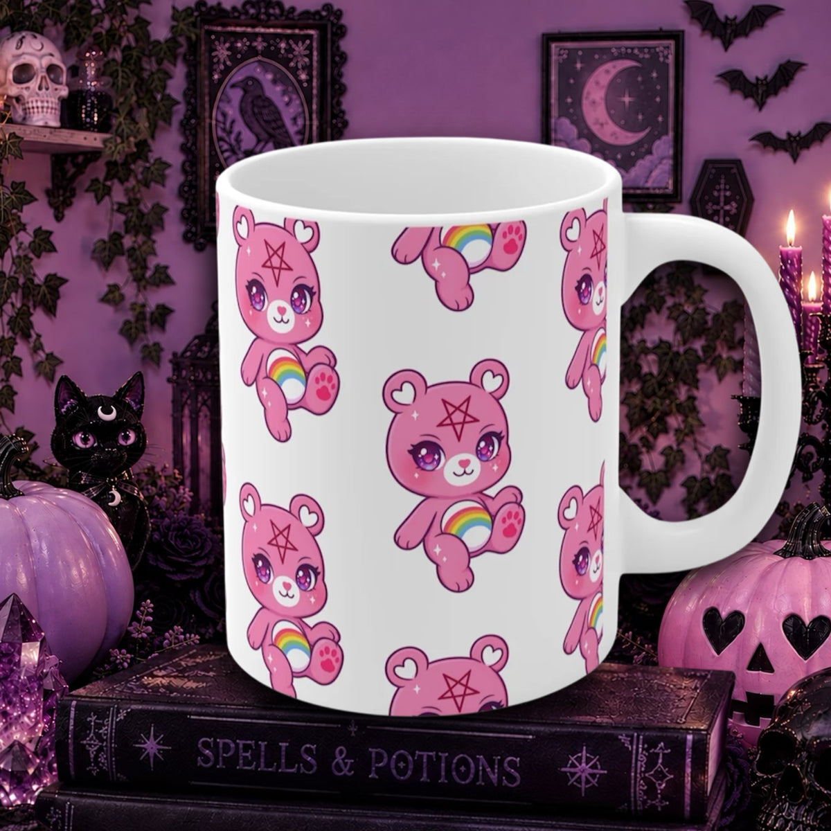 A white ceramic mug with a repeating pattern of pink cartoon bears holding rainbows and wearing pentagrams, displayed on a gothic-themed shelf with candles, pumpkins, and a black cat figurine.