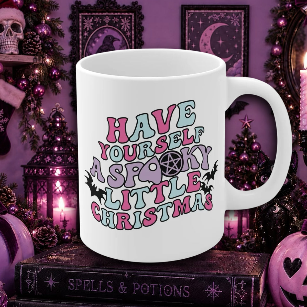 A white ceramic mug with the phrase 'HAVE YOURSELF A SPOOKY LITTLE CHRISTMAS' in pastel pink, blue, and purple lettering, displayed on a gothic-themed background with candles, lanterns, and witch decorations.